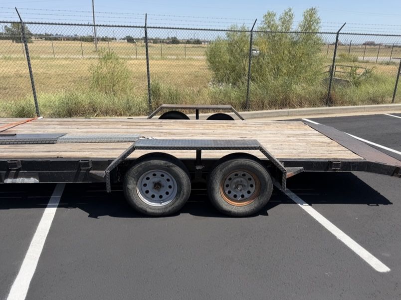 Side profile of a 3/16 inch tread plate drive over trailer fender showing the low angled ramp at each end and the flat top spanning both tandem axle tires