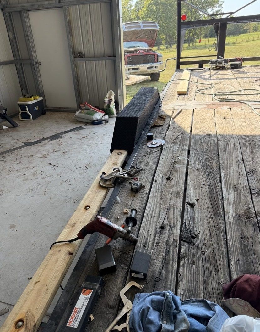 Drive over trailer fender in 3/16 inch steel tread plate clamped on a trailer deck during welding